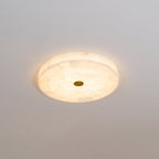 Kristy ceiling lamp lit in cool white, its tiled face reading almost uniform from a low angle