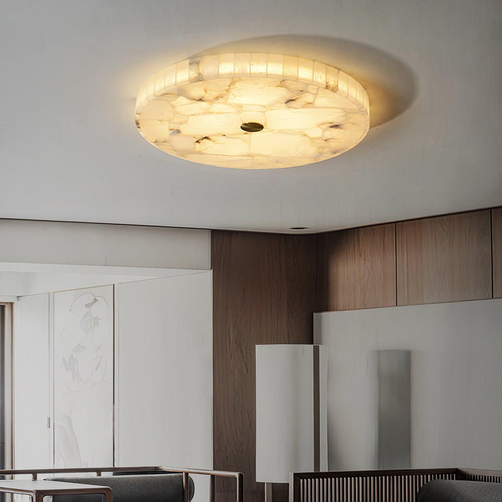 Kristy ceiling lamp lit in a living room with walnut panelling and pale artwork below