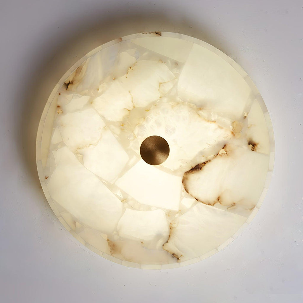 Kristy ceiling lamp seen face-on, caramel veining spreading out from the brushed brass centre