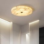 Kristy ceiling lamp lit in a white hallway with fluted wall panelling below