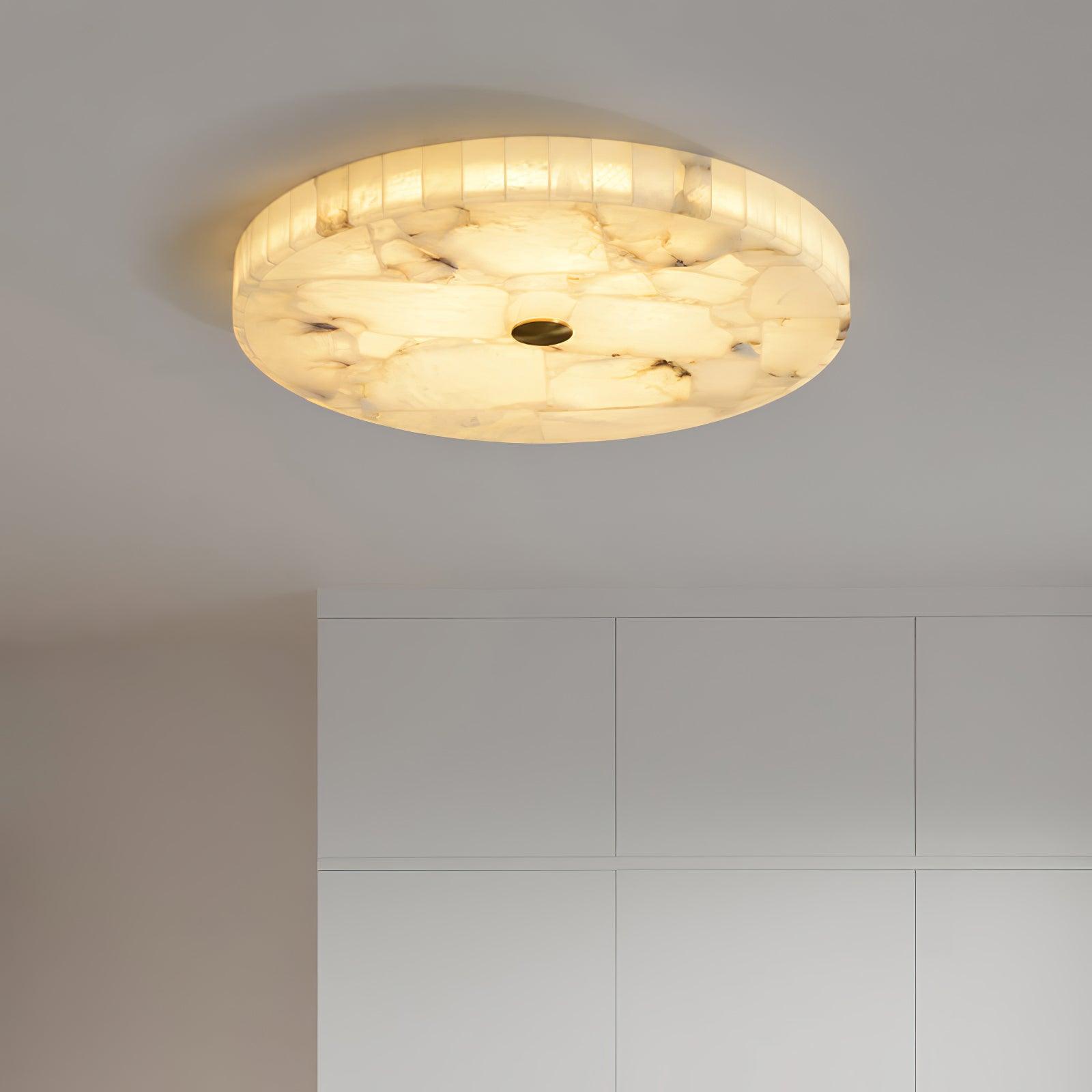 Kristy ceiling lamp lit above tall white cabinet doors, seen from a low angle