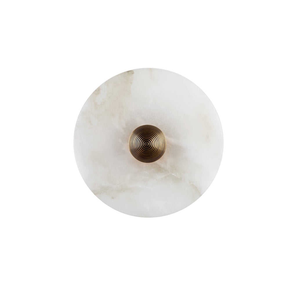 Clérachic head-on studio shot of the round sconce, gold fluted boss centred on the pale veined alabaster shade.