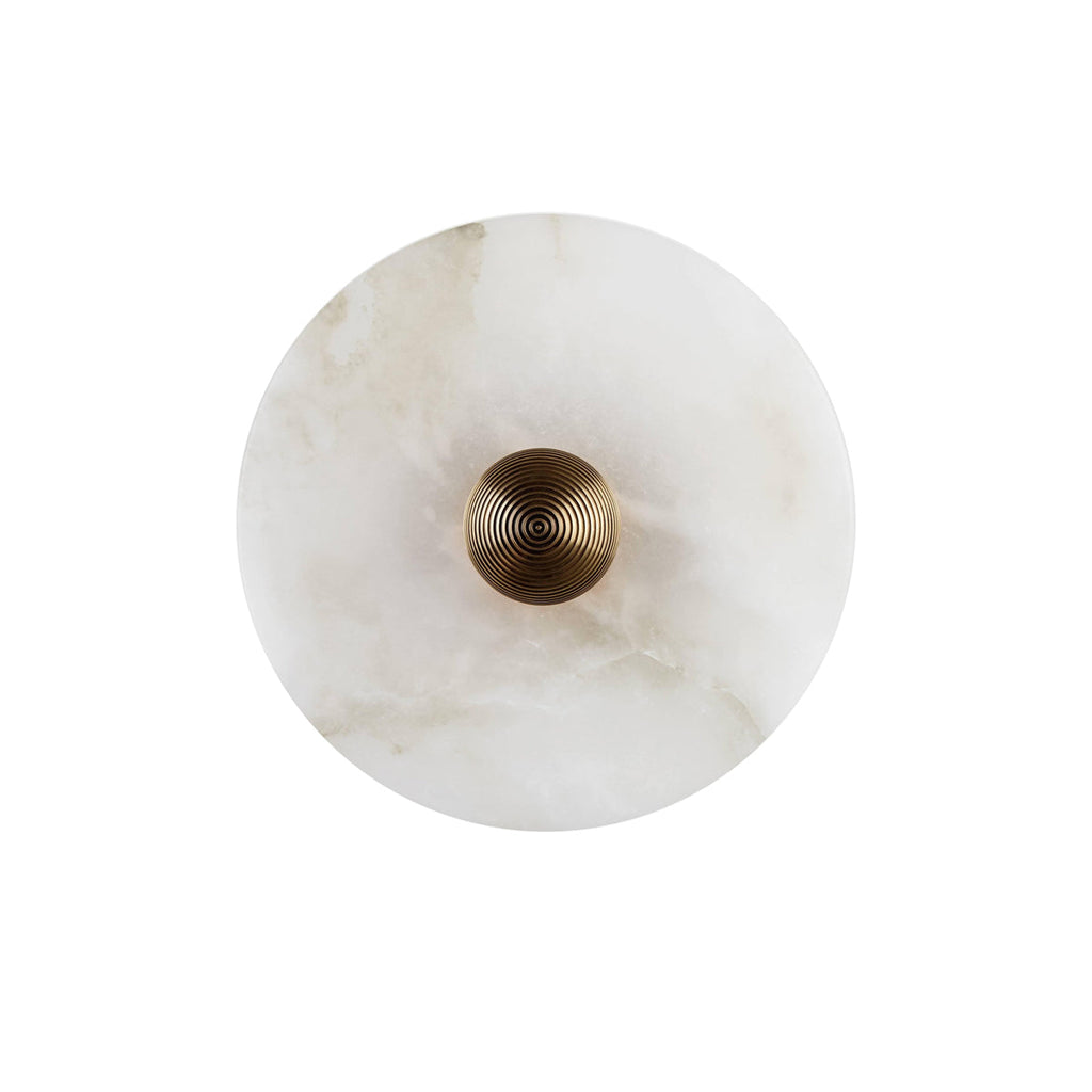 The Clérachic round alabaster sconce filling the frame, showing grey-toned veining across the polished stone disc.
