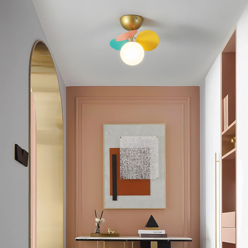 Multi-head macaron ceiling lamp glowing softly in a room