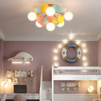 Macaron ceiling lamp with pastel discs glowing in a bedroom