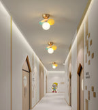 Pastel macaron ceiling lamp styled above a seating area