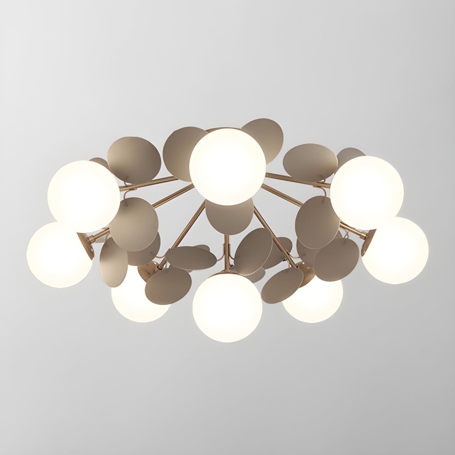 Macaron ceiling lamp with white discs on a plain background