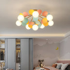 Acrylic leaf discs catching soft light on the ceiling lamp