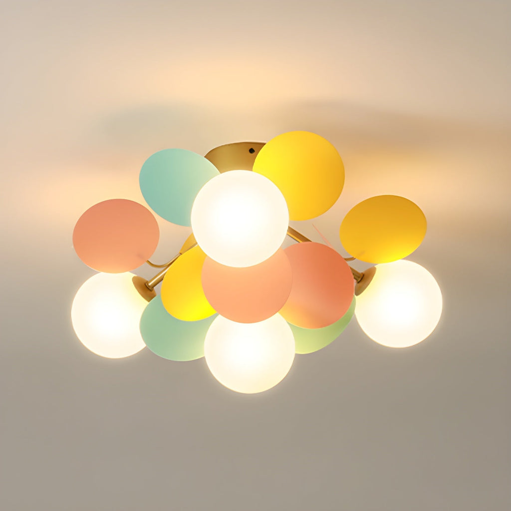 Macaron ceiling lamp glowing warm white above a desk