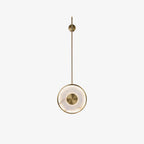 The same fixture on white, brass centre boss set into the round alabaster face.