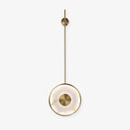 The longer-rod version on white, the disc hanging well below its wall mount.