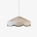 Studio view of this Clérachic pendant, its pleated linen cone edged with a scalloped green trim.