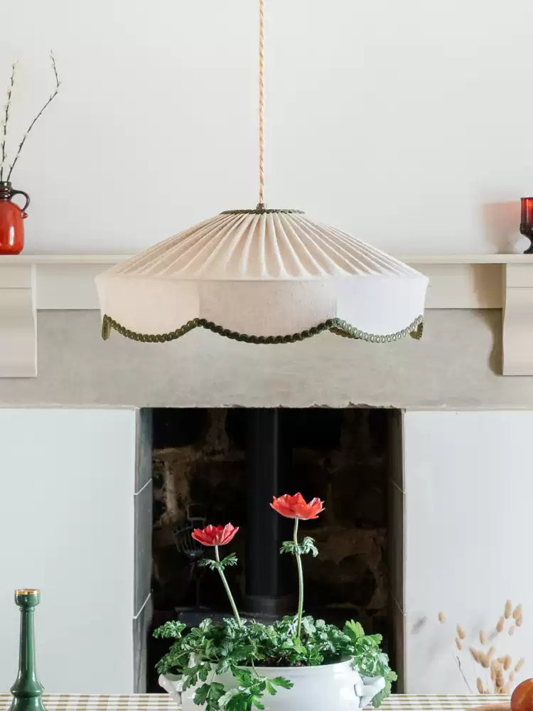 Another view of this Clérachic pendant above the mantelpiece, its pleats catching the daylight.