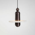 Saturn alabaster pendant light in dark bronze, single stone disc lit from within, side view on grey