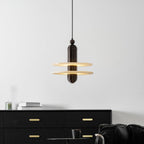 Dark bronze Saturn pendant centred on a white wall, light spilling from between the two discs