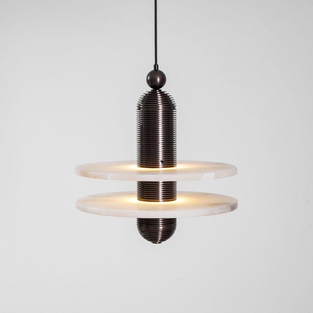 Saturn alabaster pendant light in dark bronze with two stacked stone discs, both edges glowing
