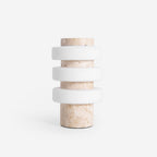 Studio shot of the unlit Clérachic travertine table lamp on a white background, showing the stacked ring shade.
