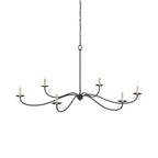 A detailed studio shot of this Clérachic chandelier in black finish, its candle bulbs lit and bare of shades.