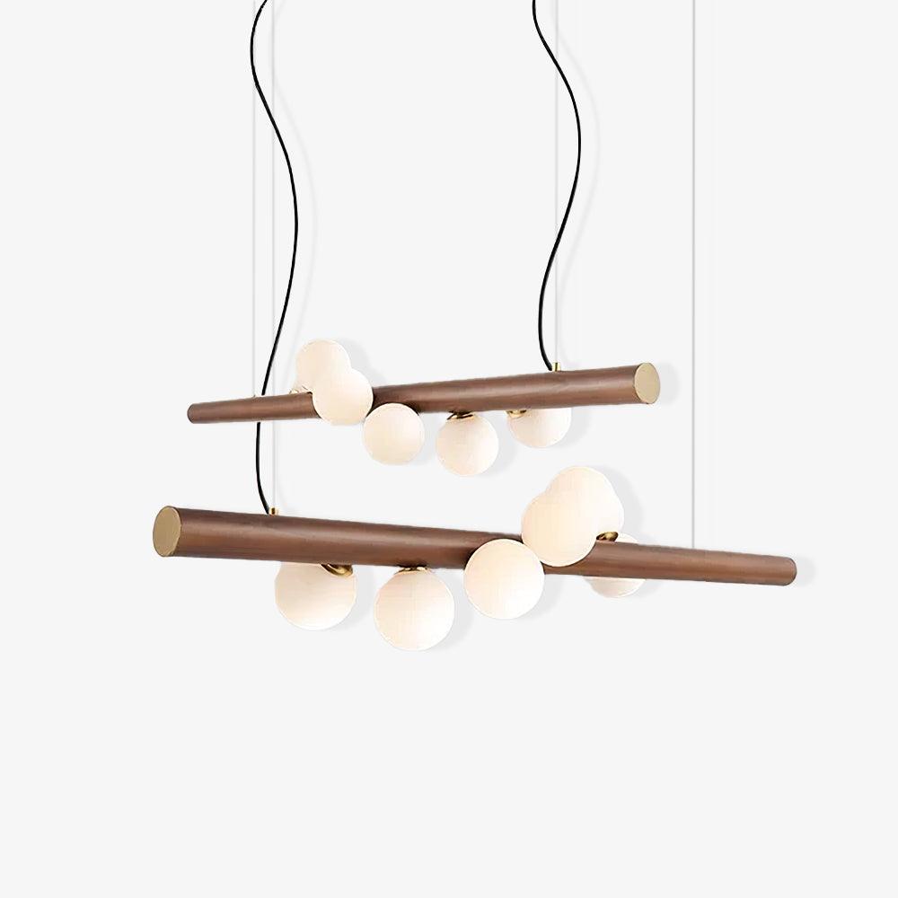 Scandinavian walnut pendant light with opal glass globes lit