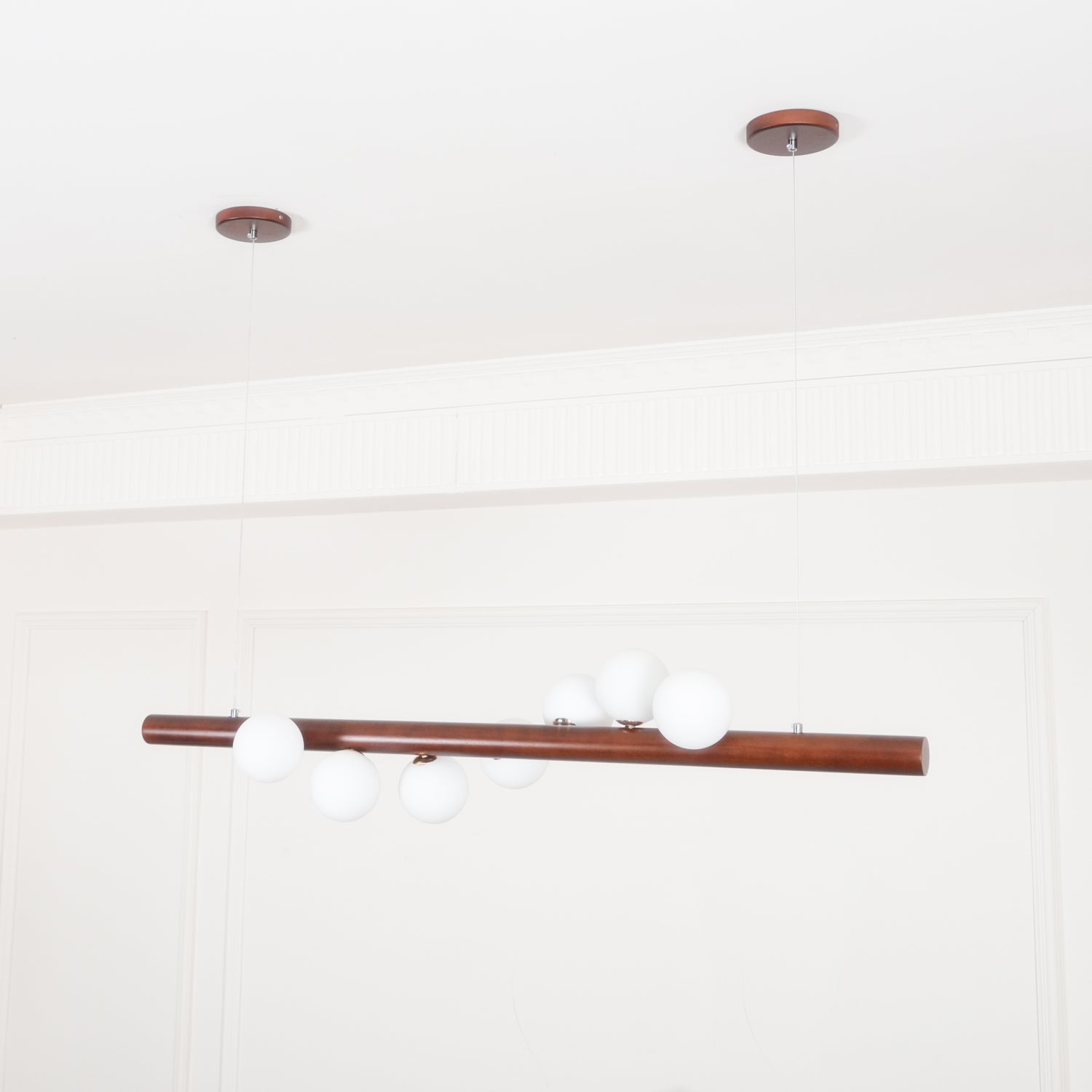 Scandinavian walnut pendant light with five opal glass globes