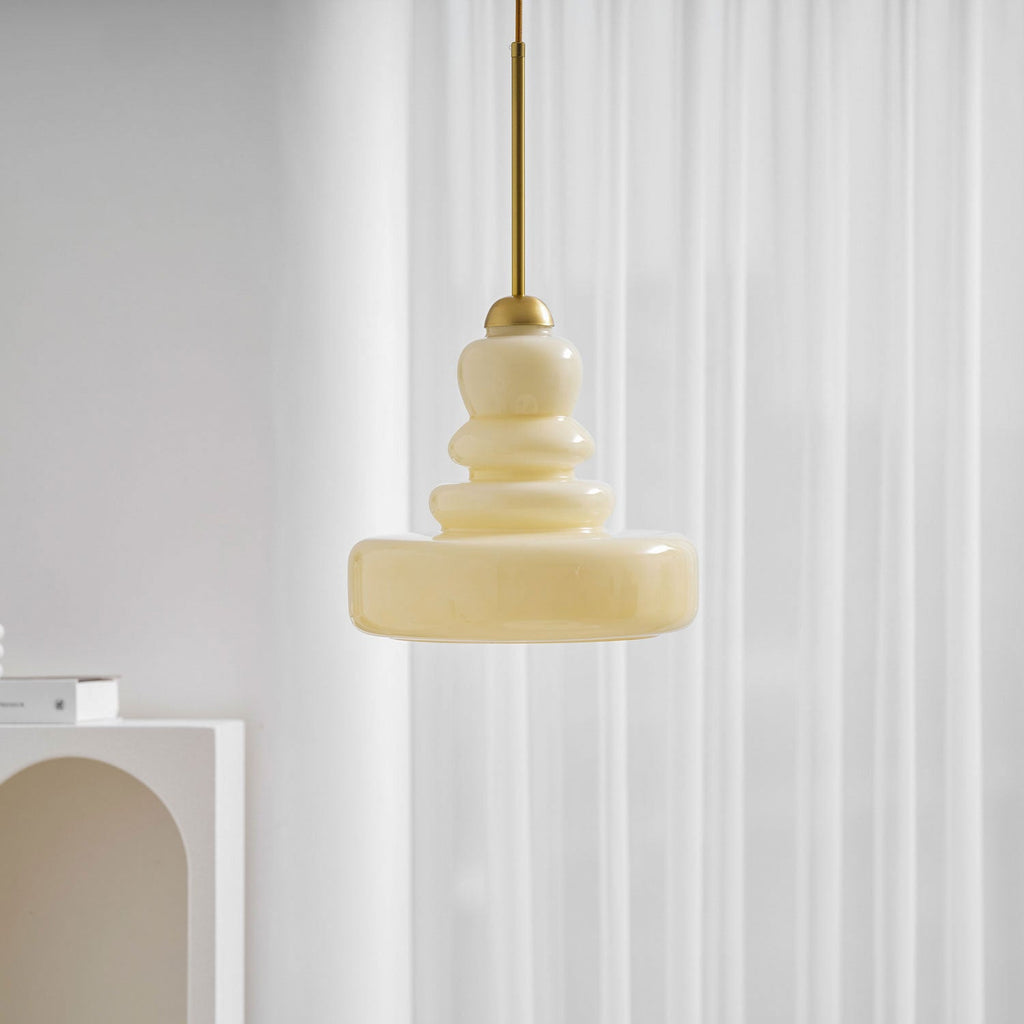 Schoolhouse pendant with glass shade in a cozy room corner