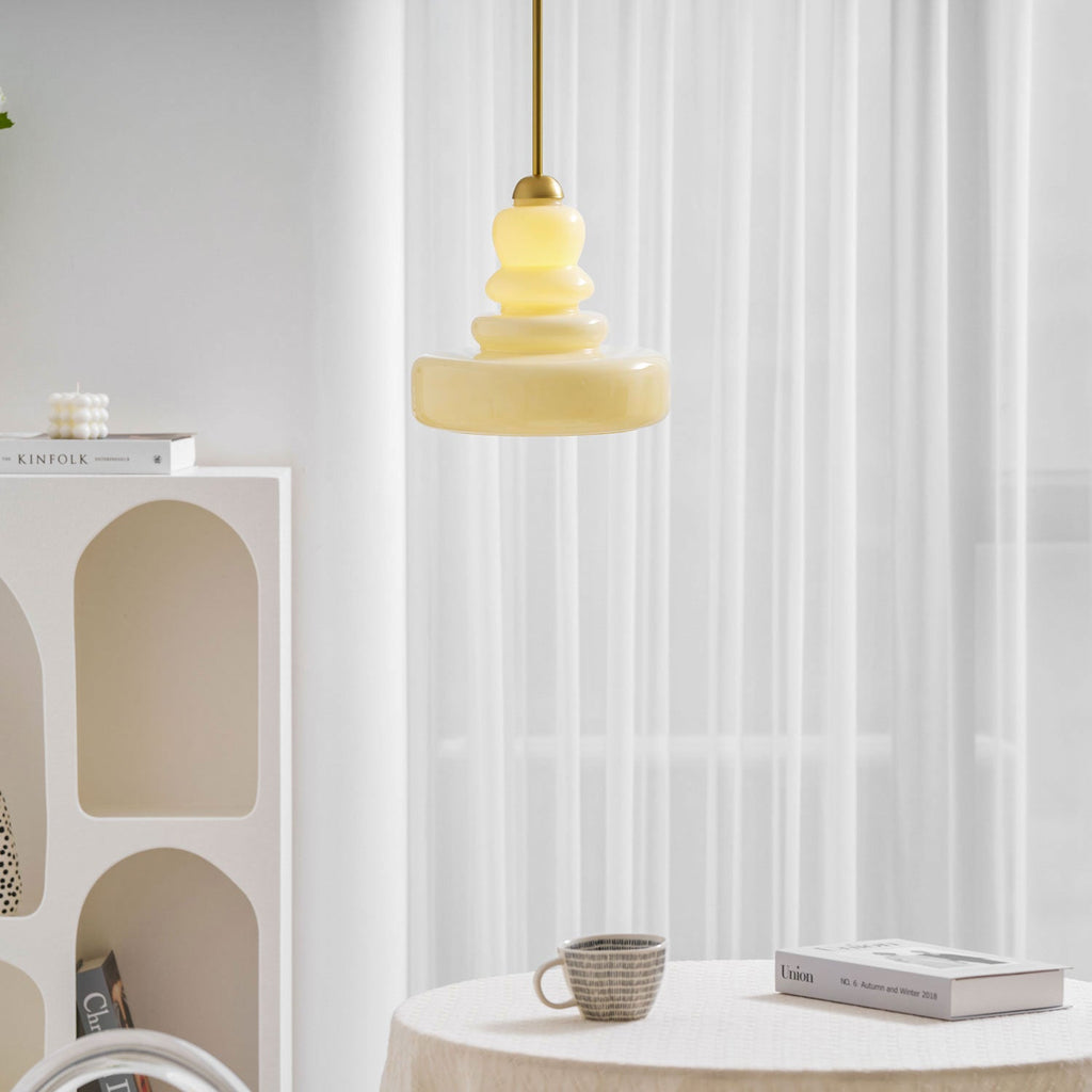 Beige schoolhouse pendant adding warm light to an interior