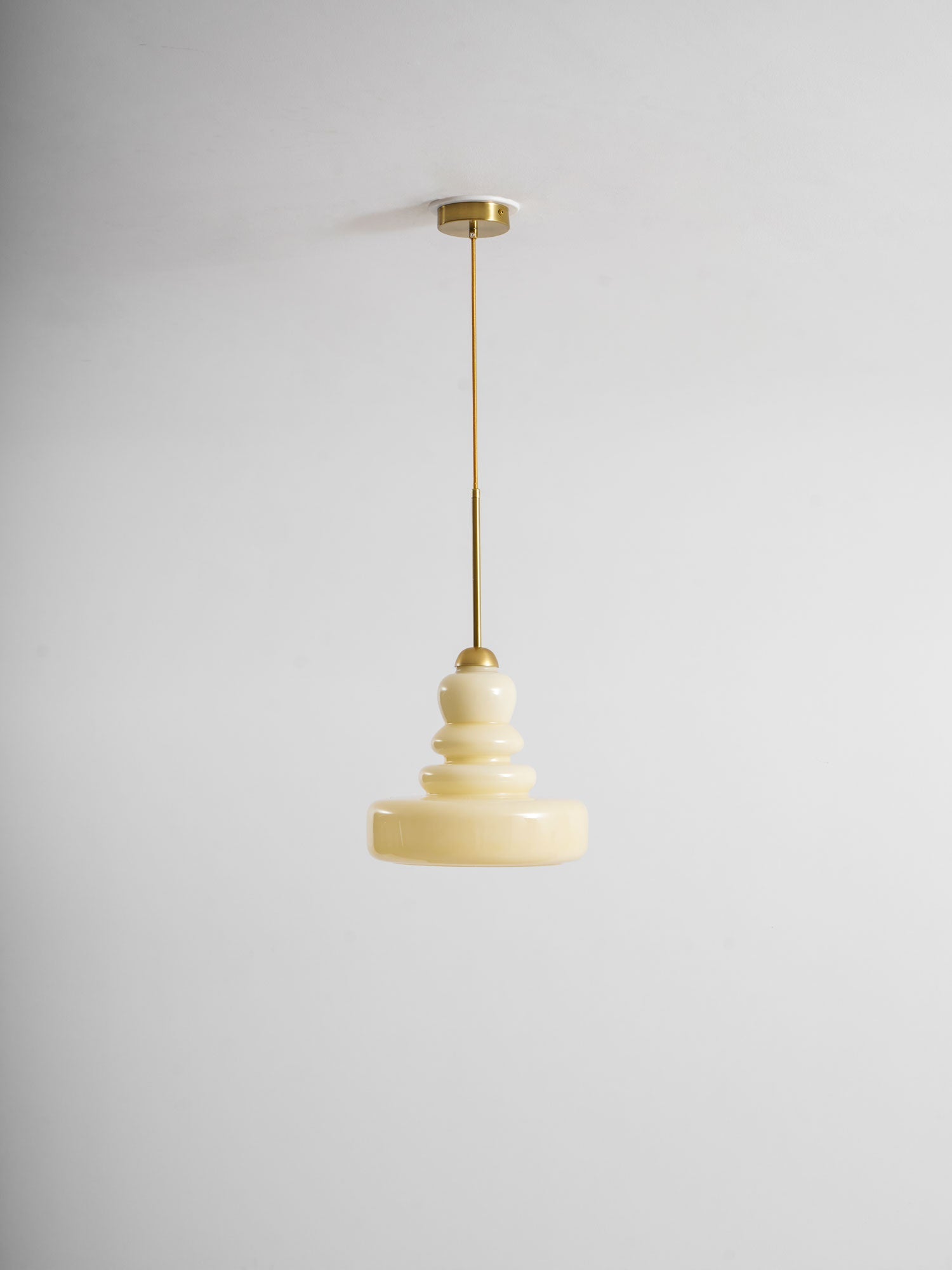 Schoolhouse glass pendant light detail of glowing shade