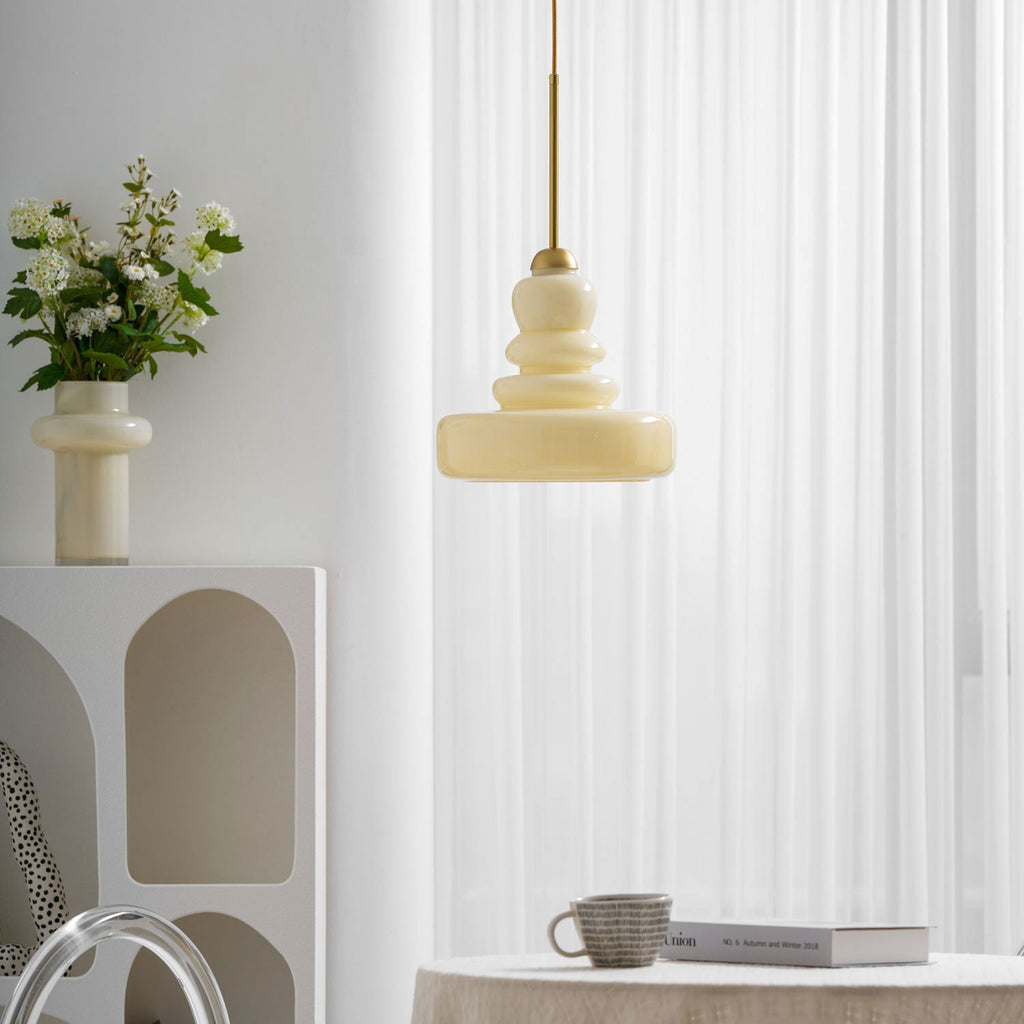 Green schoolhouse glass pendant glowing in a vintage interior