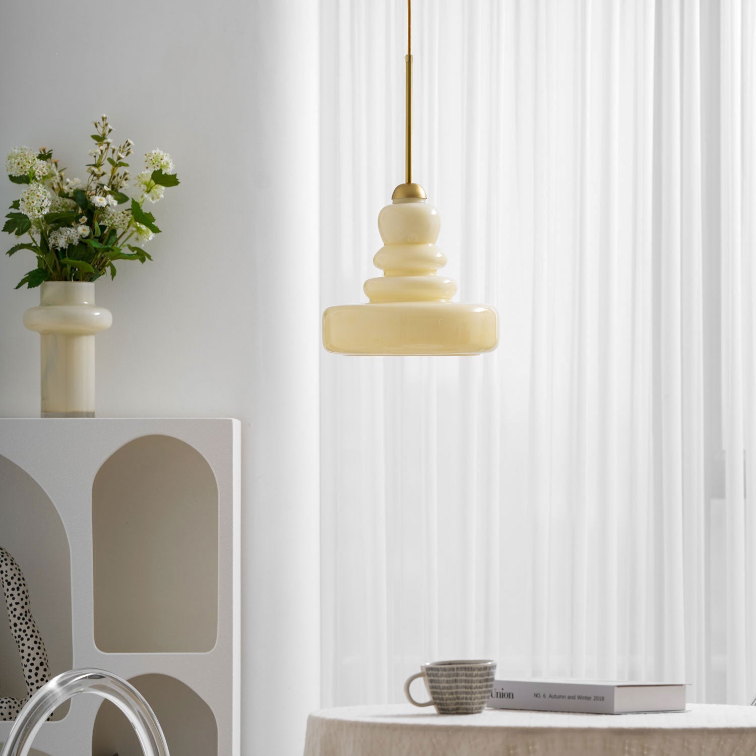 Green schoolhouse glass pendant glowing in a vintage interior