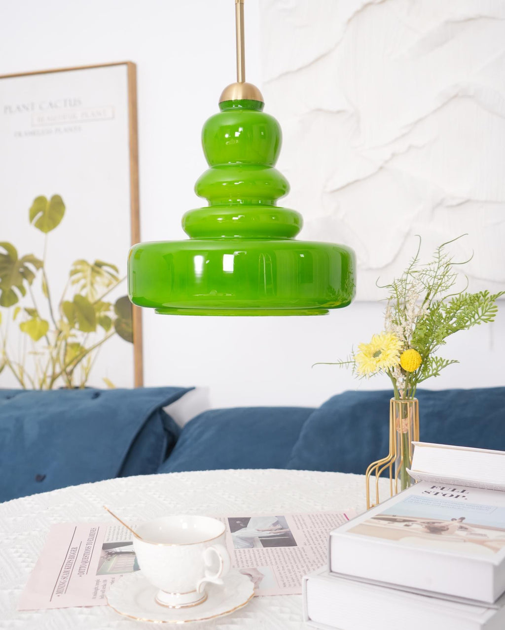 Schoolhouse glass pendant light glowing in an elegant setting