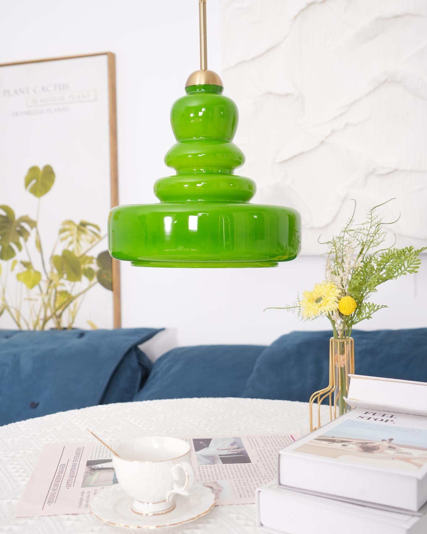 Schoolhouse glass pendant light glowing in an elegant setting