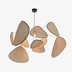 A studio shot on a white background catches light along one side of this Clérachic pendant's bamboo-weave paddles.
