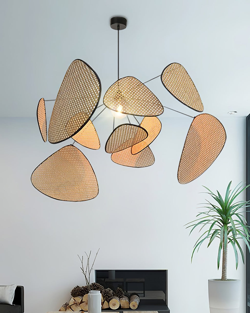 In a living room with a pale blue wall, this Clérachic pendant hangs near a small fireplace and potted plant.