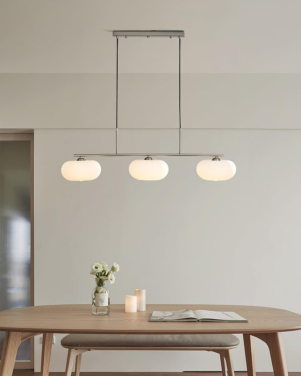 Linear globe pendant adding warm light to a modern interior
