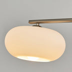 Linear pendant light with three soft glowing glass globes