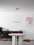 Gold leaf chandelier adding warmth to a modern room