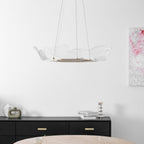 Layered leaf-form chandelier with soft warm-white glow