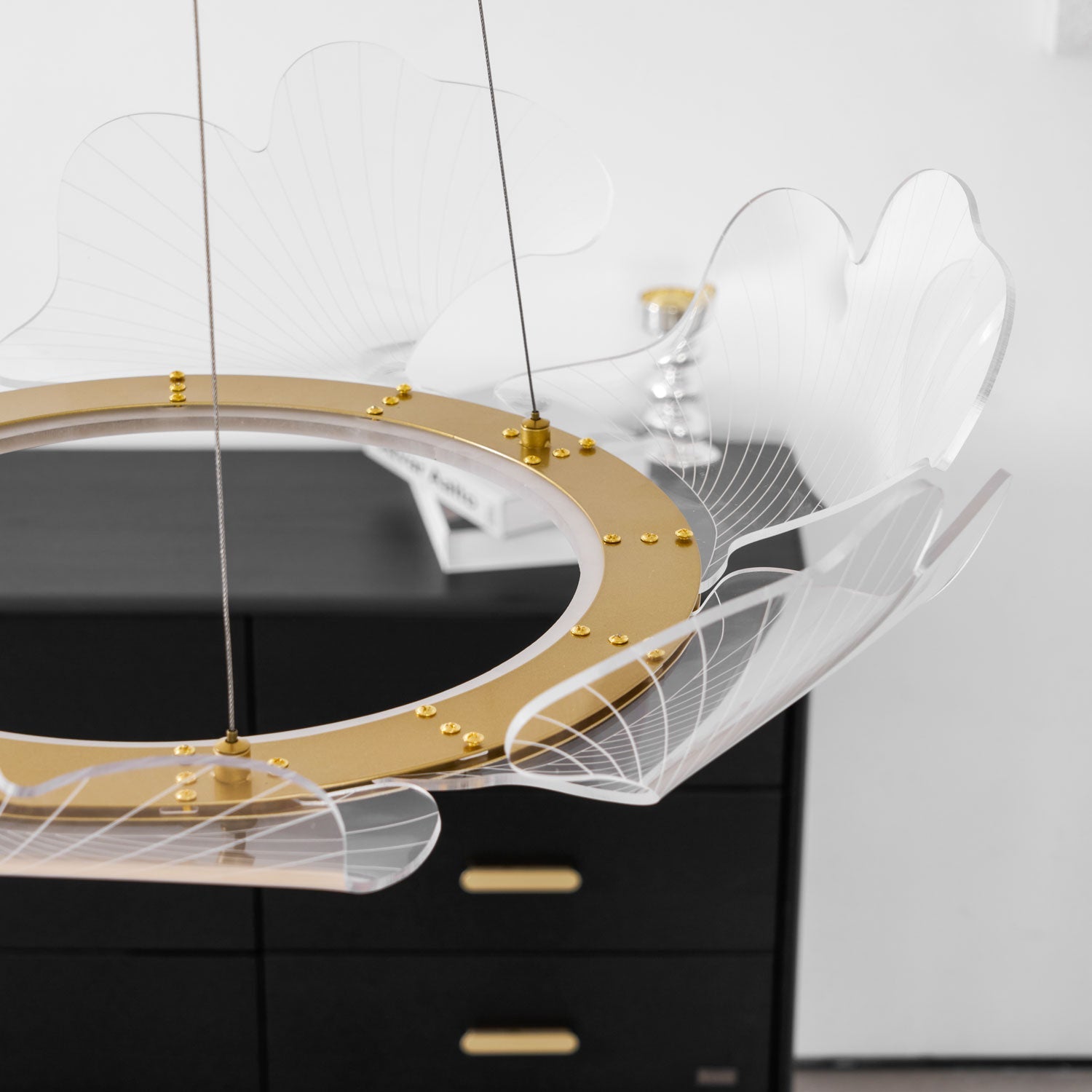 Clear acrylic gold leaf chandelier seen from underneath