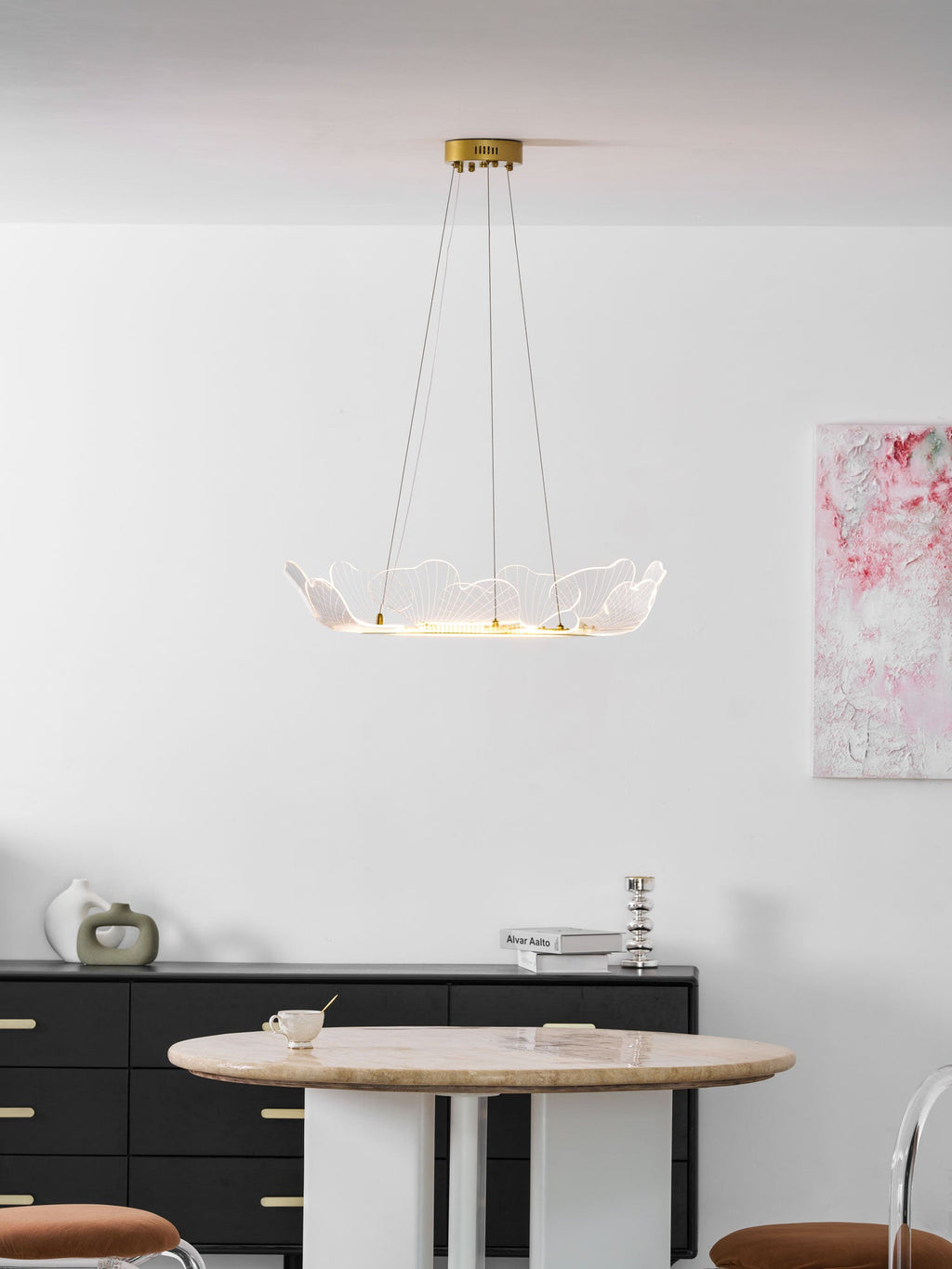 Layered acrylic leaf chandelier with a warm gold finish