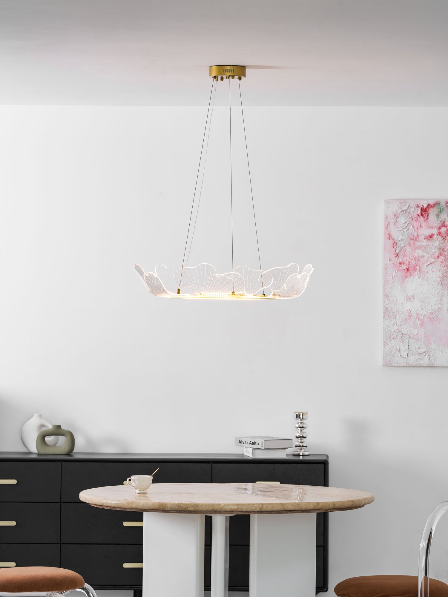 Layered acrylic leaf chandelier with a warm gold finish