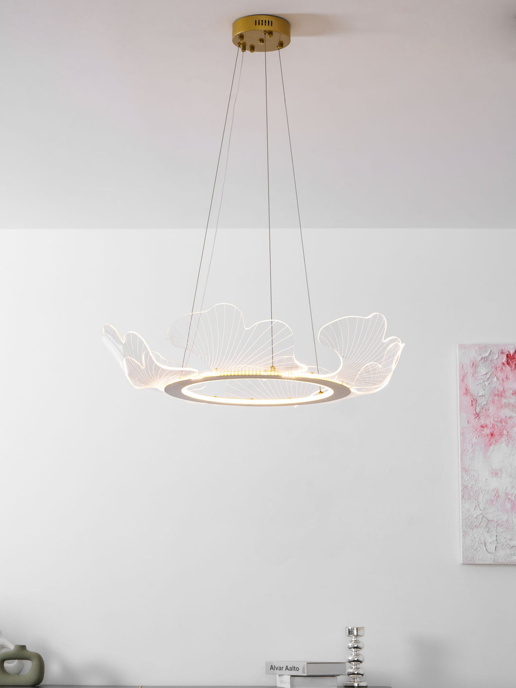 Sea leaf chandelier glowing softly in a styled living room
