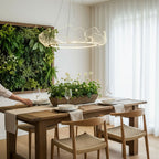Gold leaf-form chandelier casting warm light over a room