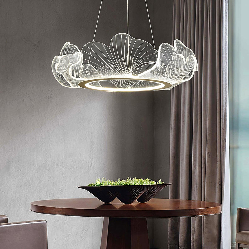 Gold leaf chandelier suspended above a modern interior