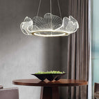 Gold leaf chandelier suspended above a modern interior