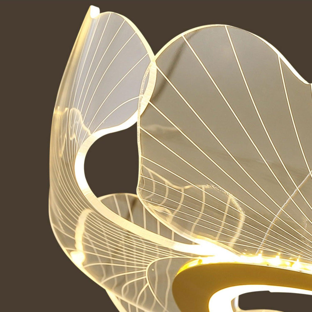 Leaf-form chandelier with gold edges and soft warm light