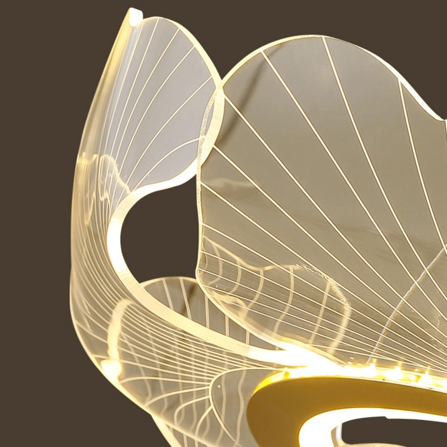 Leaf-form chandelier with gold edges and soft warm light