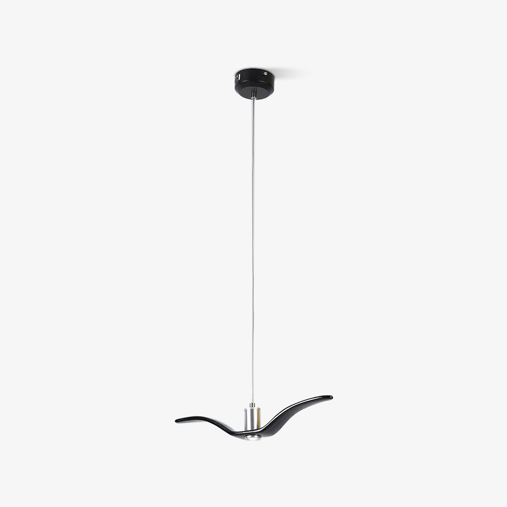 A black bird-shaped pendant from this Clérachic light drops on a long cord from a round black canopy, on a light-grey backdrop.