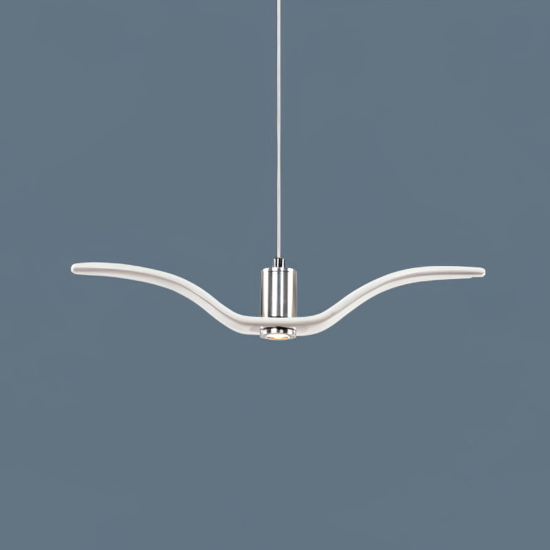 On a slate-blue backdrop, a single white bird-shaped pendant from this Clérachic light hangs with its wings spread wide.