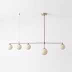 This nickel-finish Clérachic chandelier hangs unlit on a plain white background, its five alabaster balls level.