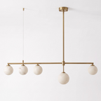 Seen at an angle on a plain white background, this brass Clérachic chandelier hangs unlit, its cable and rod visible.